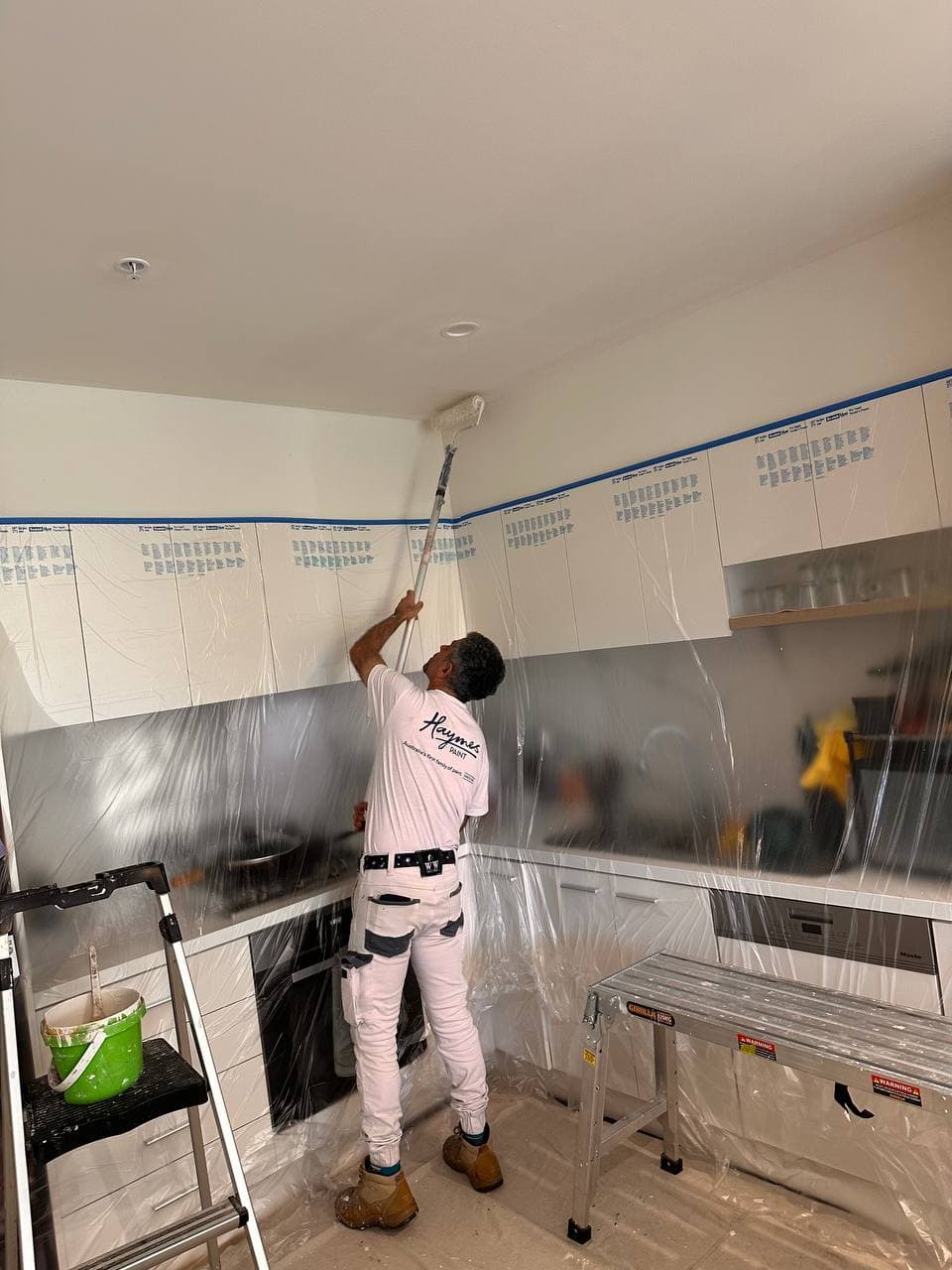 Hossain, founder of MAK Painting Group, painting on-site in Melbourne